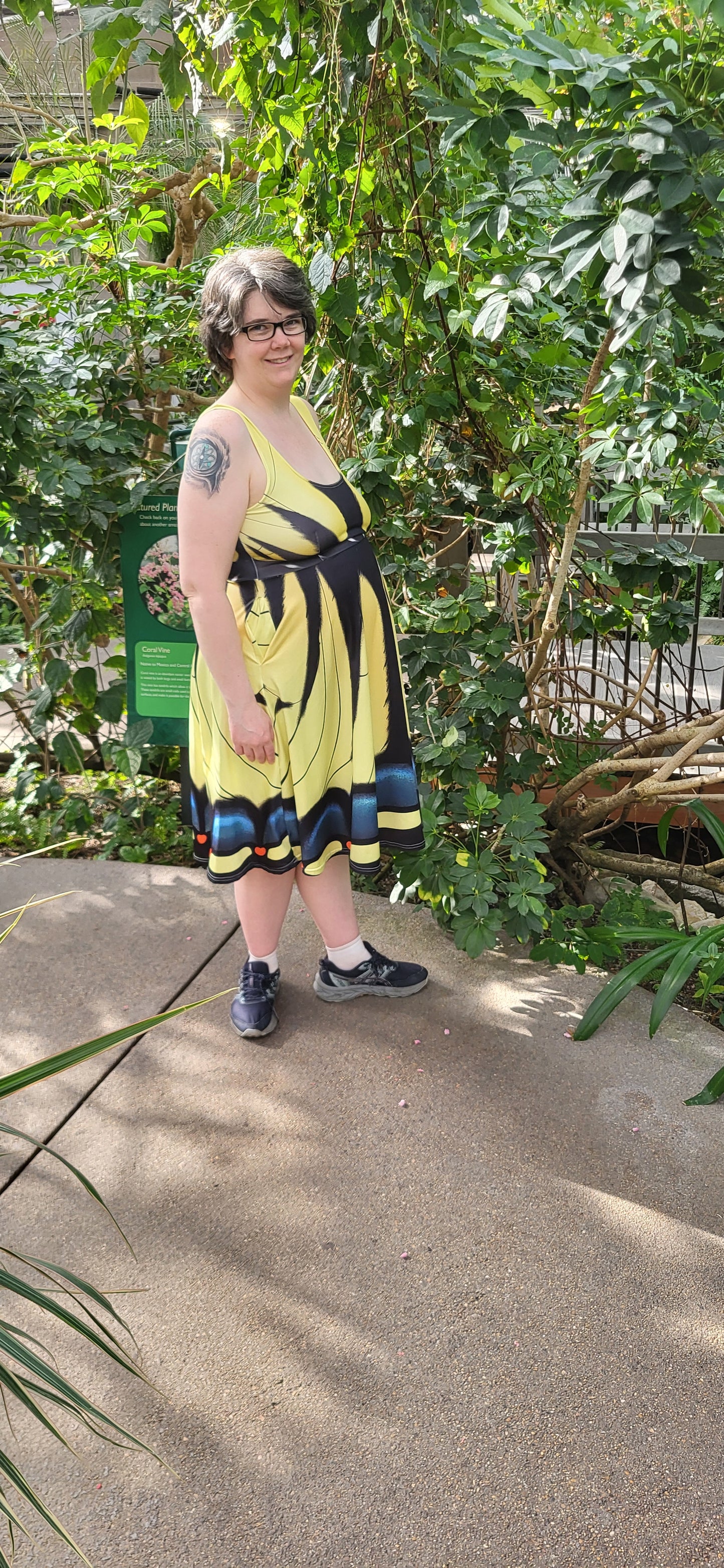 person standing outside with tiger swallowtail dress