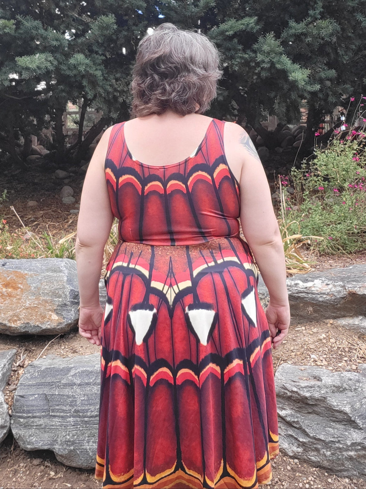Atlas Moth dress in russet with a butterfly wing pattern, sleeveless and knee-length made of stretchy fabric.