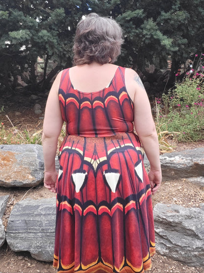 Atlas Moth dress in russet with a butterfly wing pattern, sleeveless and knee-length made of stretchy fabric.